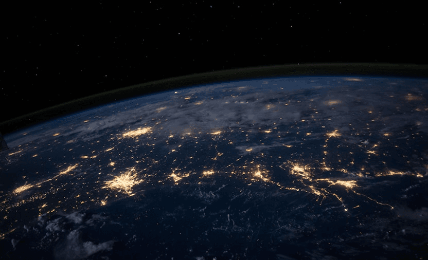 Earth at night from space, city lights and global connectivity